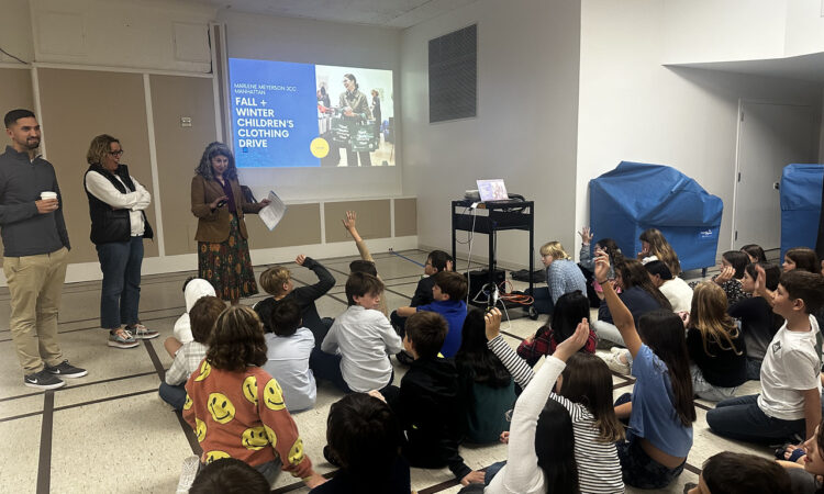 Ethical Culture students listen to Sheryl Parker from the JCC speak about the importance of giving back.