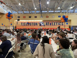 Students and families gather in the Varsity Gym for the Sports Dinner