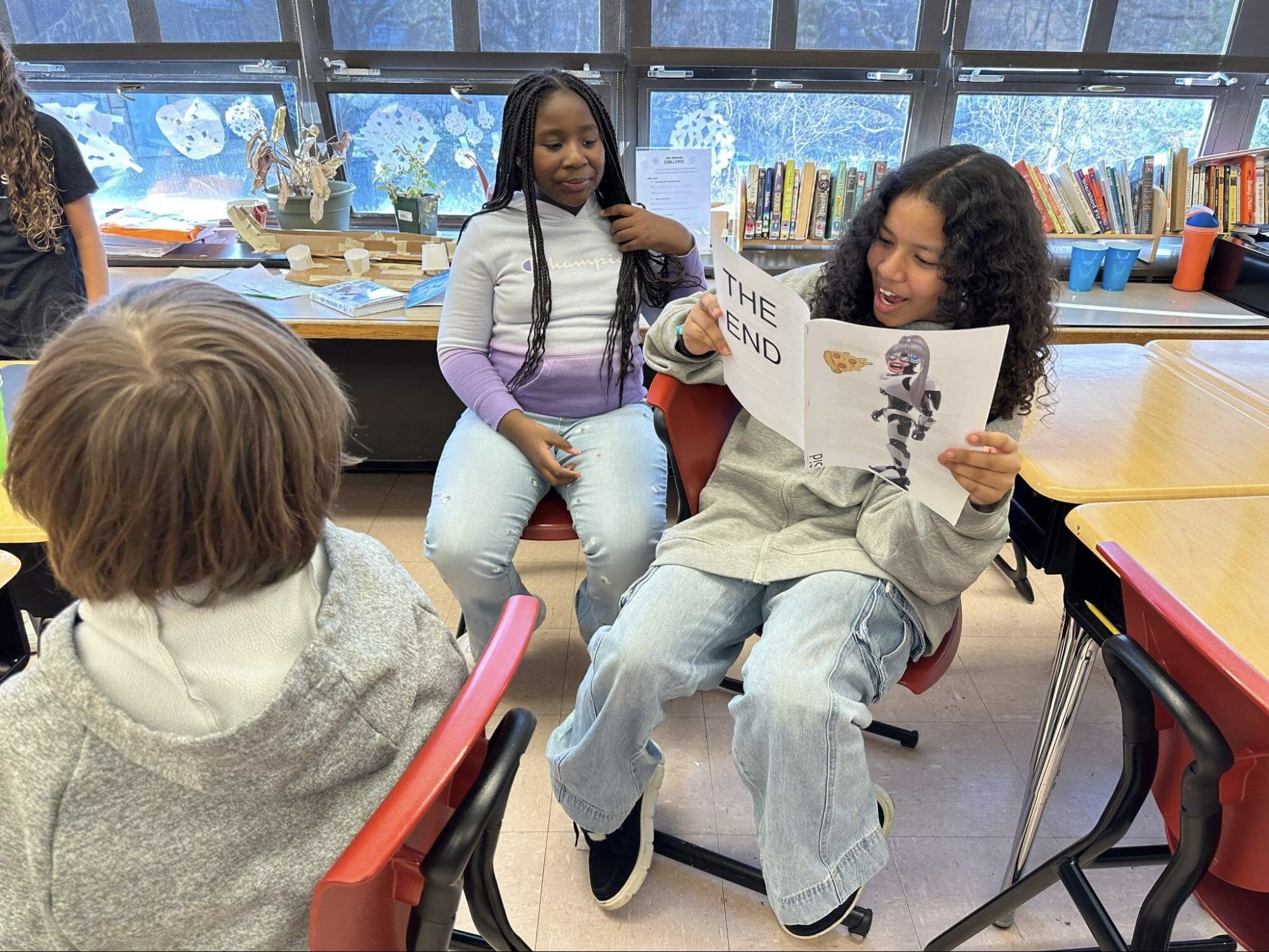 Two Ethical Culture Fieldston School Fieldston Lower students share a story during a publishing party