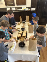 Students prepare sandwiches for the Holy Apostles Soup Kitchen.