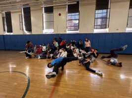 The ECFS Black and Latine CARe groups pose together after breakdancing class.