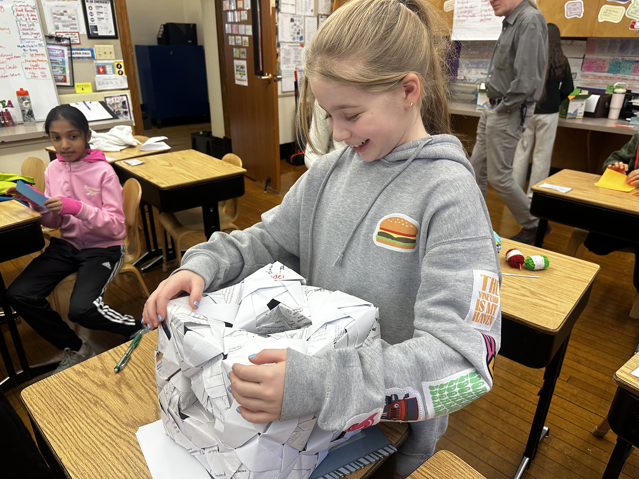 Ethical Culture 5th Grader presents her Sonobe model project in classroom at Ethical Culture Fieldston School.