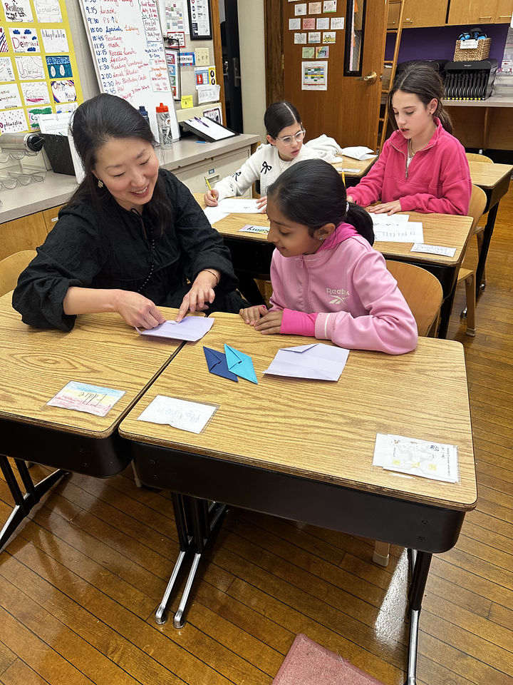 Ethical Culture 5th Grader works on Sonobe model project in classroom at Ethical Culture Fieldston School.