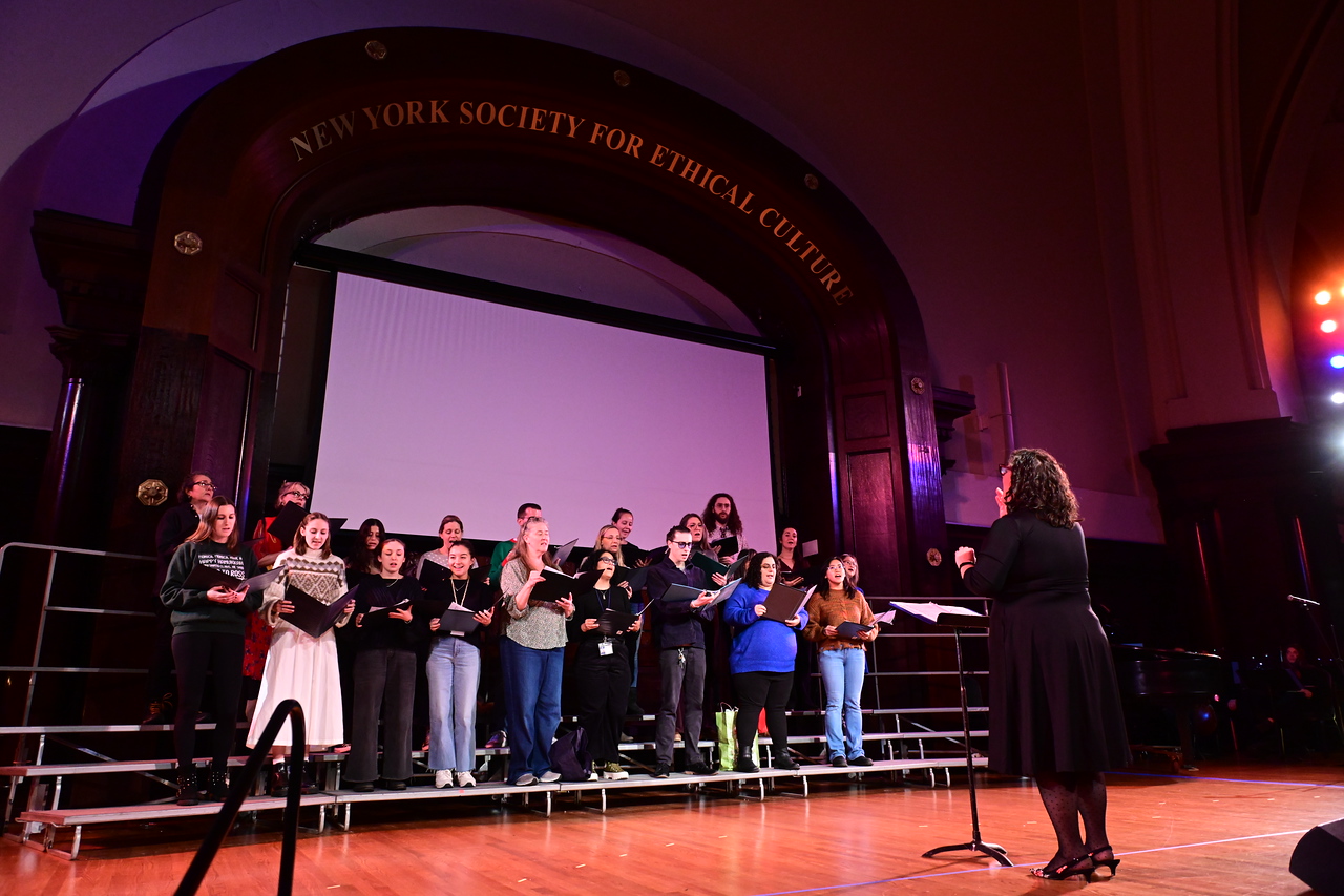 Ethical Culture faculty chorus performs at the Annual Holiday Assembly. 