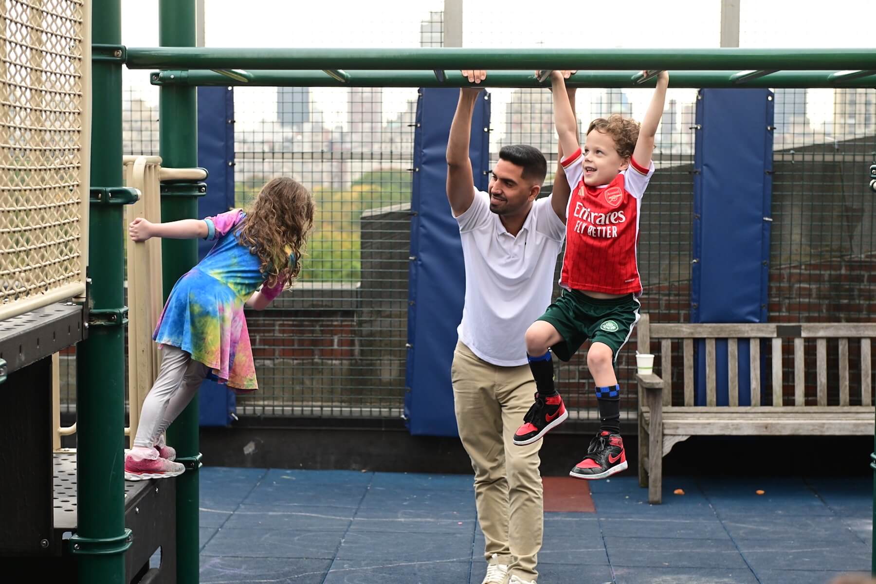 Ethical Culture Fieldston School_Feel Good Photos_Ethical Culture students swing on the playground bars