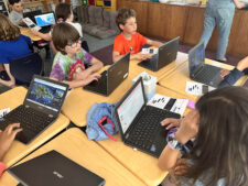 Fieldston Lower students work on their computers to perfect their Google Earth tours.