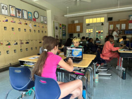 Fieldston Lower student designs her Google Earth tour on her laptop.