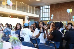 Fieldston Upper students clap in audience at Bridge to Bridge celebration.